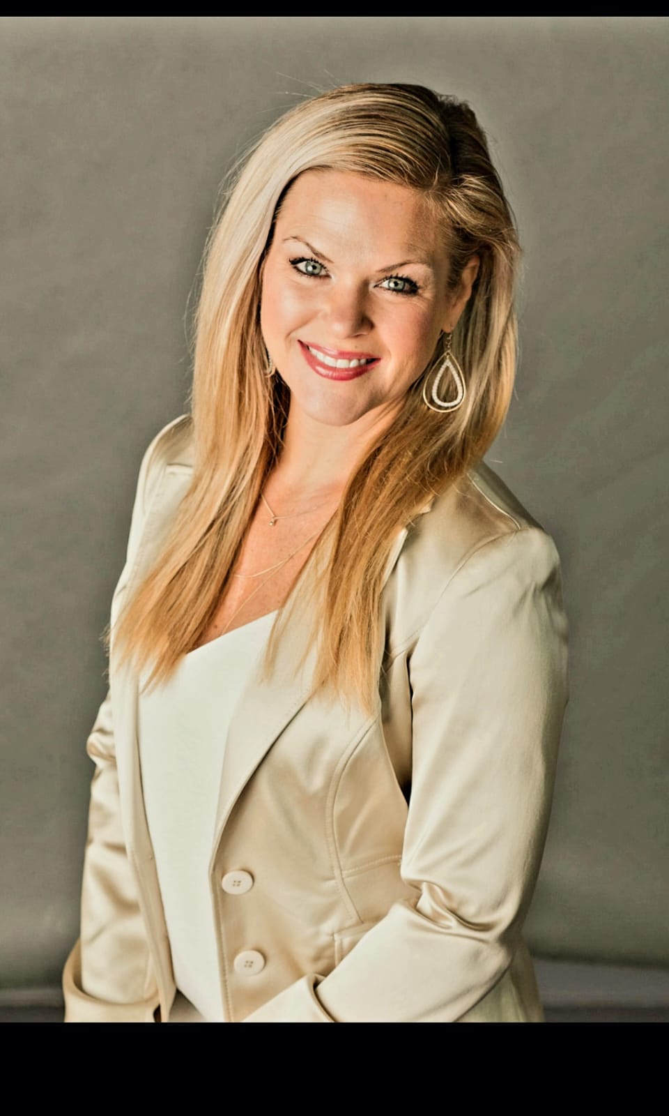 Emily Ryan, Co-Founder and Program Coordinator, in a cream blazer